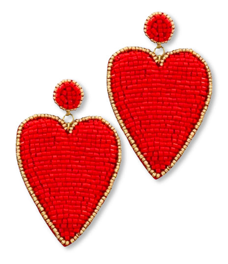 Premium Photo | A pair of red and gold heart shaped earrings with diamonds  and diamonds.